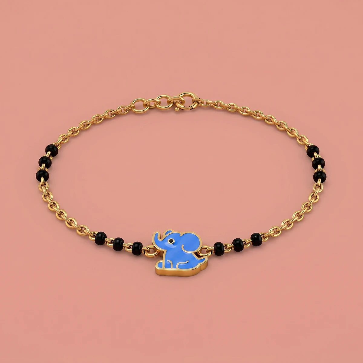 Kids gold nazariya bracelet featuring cute blue elephant charm